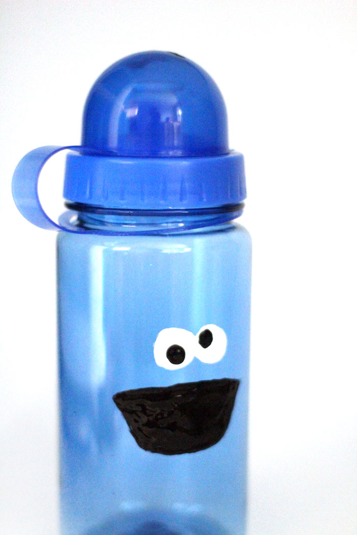 Make an adorable monster water bottle for your little one! This precious cookie monster inspired craft is easy and inexpensive to make 