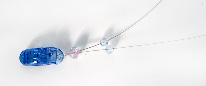 How to make a beaded pacifier holder - a new, fun tutorial! Make a DIY pacifier clip as a great easy baby shower gift, but first learn how to make it safely!