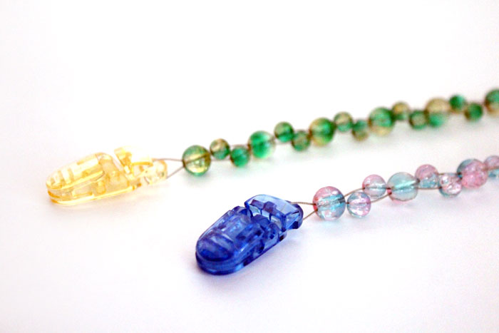 How to make a beaded pacifier holder - a new, fun tutorial! Make a DIY pacifier clip as a great easy baby shower gift, but first learn how to make it safely!