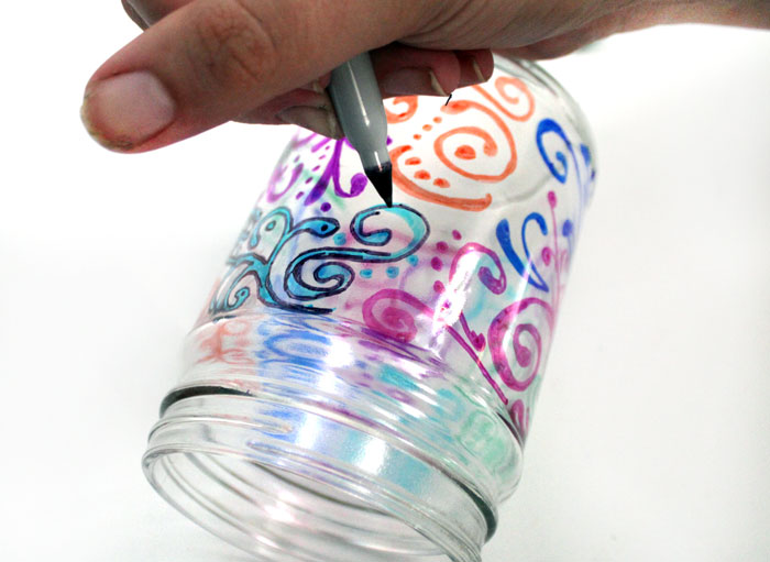 Relax with this adorable way to upcycle jars! This dots 'n doodles jar craft is a fun DIY project to help moms (or anyone) unwind.