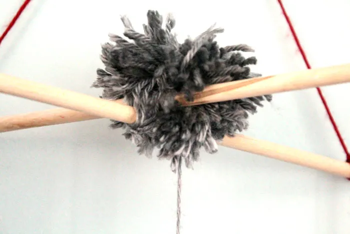 I love this precious tassel and pom pom baby mobile for my baby's nursery! Plus, this cheap and frugal nursery update with a Mickey Mouse theme is awesome!