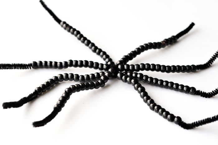 Isn't this not-so-spooky spider adorable? Make a beaded spider kids' craft for Halloween or any time of year!