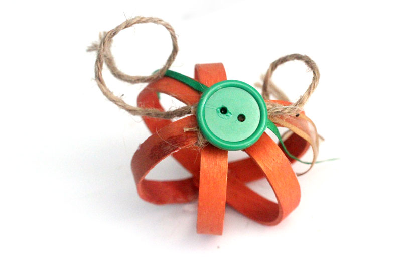 This bent craft stick pumpkin craft is so adorable - you'll want to make a lot for your Autumn or Halloween decor!