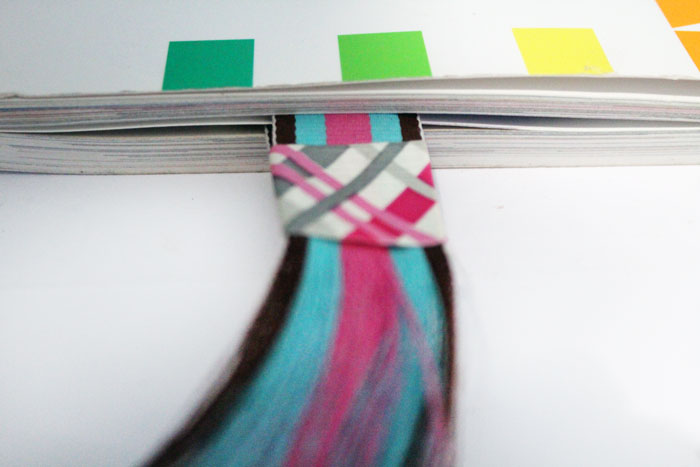 Make your own DIY magnetic bookmarks with a fun fringe! It's a super easy party craft for kids or teens, and great for encouraging reading. 