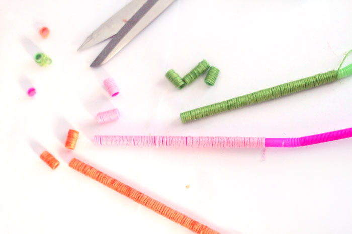 Make these beautiful DIY string wrapped beads and then make your own jewelry with them! It's an easy jewelry making craft for kids, teens, or beginners.