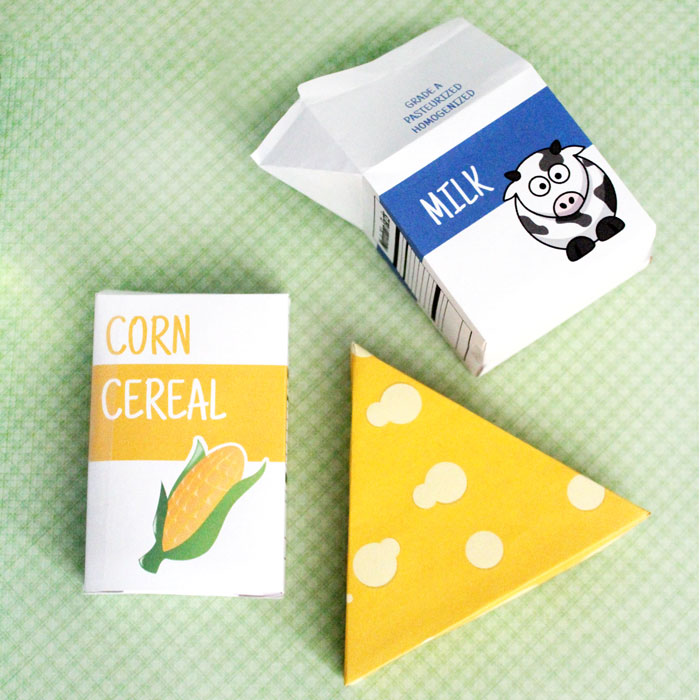 Oh, these are so stinkin' cute - and you can print it for free! Free printable groceries for pretend play and fun kids activities - including cereal, milk, and cheese. Print the designs or make your own.