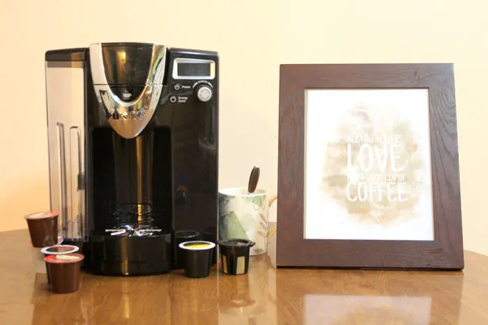 Download and print this free coffee wall art. It's an adorable watercolor print that says 'all you need it love and a good cup of coffee"! Plus, read my iCoffee Opus review - a single serve brewer.