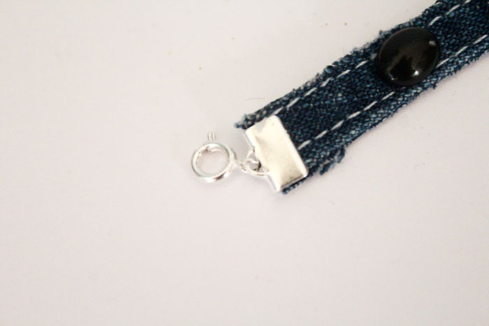 Make this simple no sew DIY denim bracelet by using recycled jeans! This easy jewelry making tutorial is a perfect. cool craft for teens and tweens.