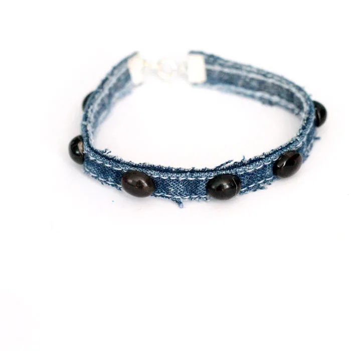 Make this simple no sew DIY denim bracelet by using recycled jeans! This easy jewelry making tutorial is a perfect. cool craft for teens and tweens.