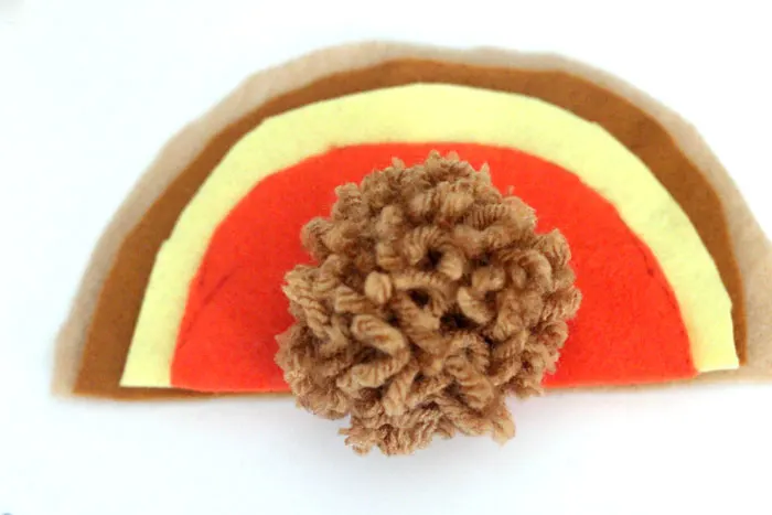 It's so easy to make this adorable pompom Thanksgiving turkey crafts for kids! It can be used as a toy, a napkin ring, a centerpiece, and other fun ideas. Love the DIY pom pom - I need to do it this autumn.