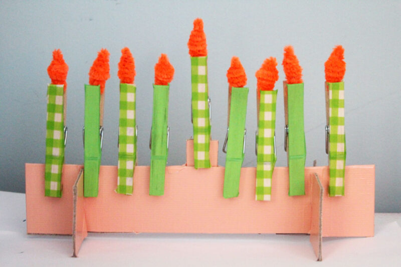 Make this adorable Hanukkah Menorah craft for kids. It's an adorable DIY toy menorah that I made for my toddler to light on Chanukah. 