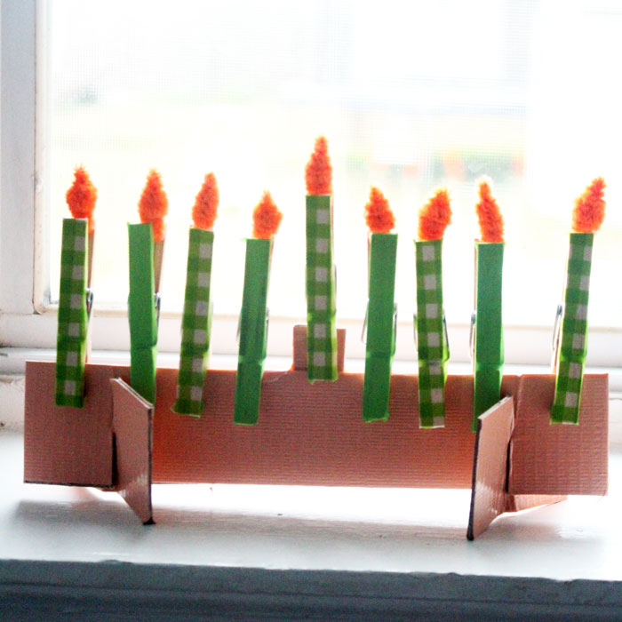 Make this adorable Hanukkah Menorah craft for kids. It's an adorable DIY toy menorah that I made for my toddler to light on Chanukah.