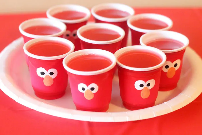 Elmo Jello cups | I LOVE these Elmo birthday party ideas - the tablescape is so cool! An Elmo theme is perfect for a first birthday party, or even second or third toddler birthdays. Check out this list of easy ideas.