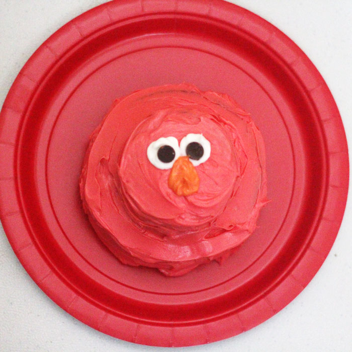 Check out this really cool and easy Elmo birthday cake! It's actually two mini cakelettes, and not actually layered - perfect for a first or second birthday party. You don't need to be good at cake decorating.