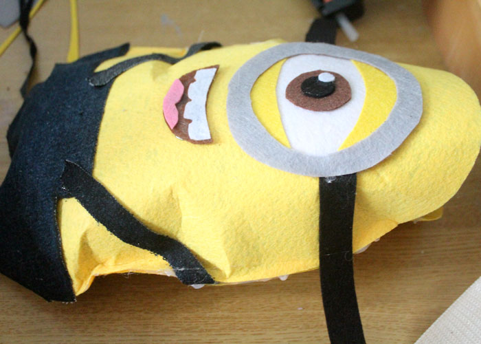 Make this fun felt minion pillow craft for your movie night! It's an adorable plush DIY minion that's easy to make and fun to cuddle!