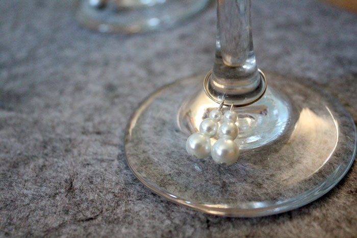 Make these easy and elegant DIY snowman stemware charms to upgrade your holiday or winter tablescape! These wine glass dangles are so pretty and easy to craft, and are perfect for Christmas, New Year's or any winter party.