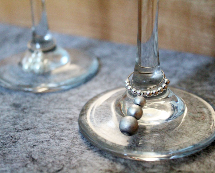 Make these easy and elegant DIY snowman stemware charms to upgrade your holiday or winter tablescape! These wine glass dangles are so pretty and easy to craft, and are perfect for Christmas, New Year's or any winter party.