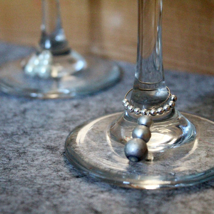 Make these easy and elegant DIY snowman stemware charms to upgrade your holiday or winter tablescape! These wine glass dangles are so pretty and easy to craft, and are perfect for Christmas, New Year's or any winter party.