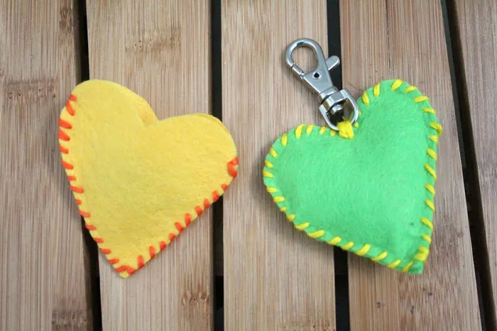 Make this adorable stitched felt craft for Valentine's day or any time of year! It includes a cute favor pouch version, and a plush heart keychain. IT's a great beginner sewing project for kids, teens, and tweens!