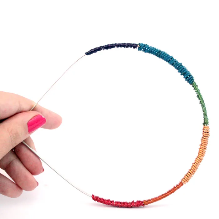 It's so easy to make this wire wrapped rainbow headband - I want to make ten! You can make it in any color, and don't need to know anything about jewelry making to start. It's an easy craft idea for teens, adults, or even big kids