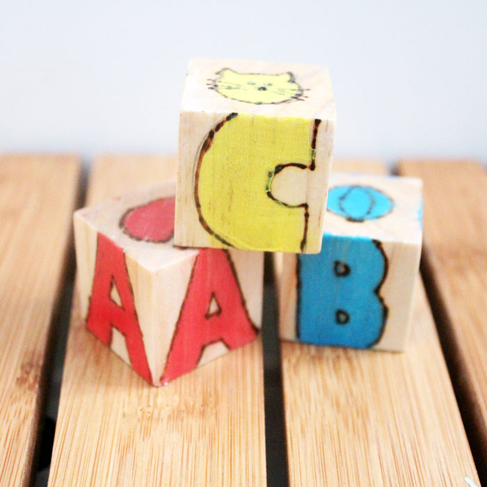 These colorful wooden alphabet blocks are surprisingly easy to make! They are so much fun to receive as a DIY baby gift and inexpensive to put together.