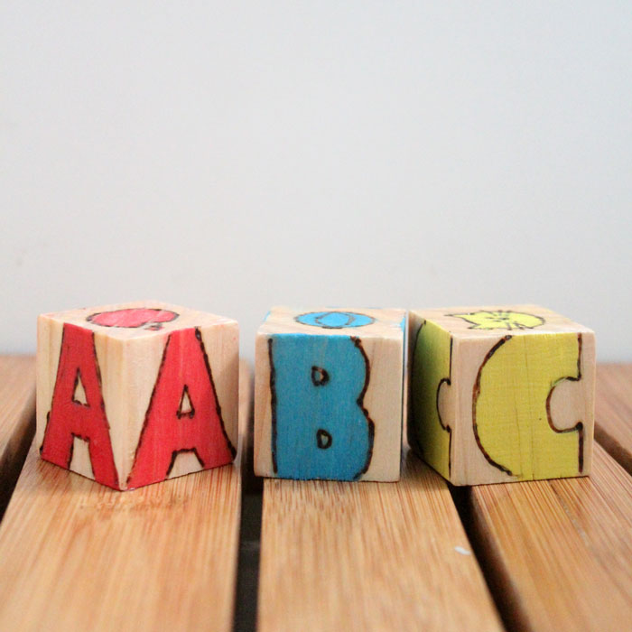 These colorful wooden alphabet blocks are surprisingly easy to make! They are so much fun to receive as a DIY baby gift and inexpensive to put together.