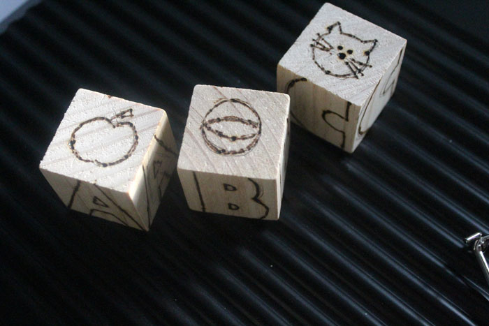 These colorful wooden alphabet blocks are surprisingly easy to make! They are so much fun to receive as a DIY baby gift and inexpensive to put together.