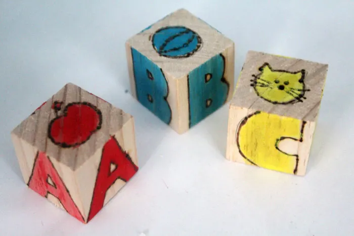 These colorful wooden alphabet blocks are surprisingly easy to make! They are so much fun to receive as a DIY baby gift and inexpensive to put together.