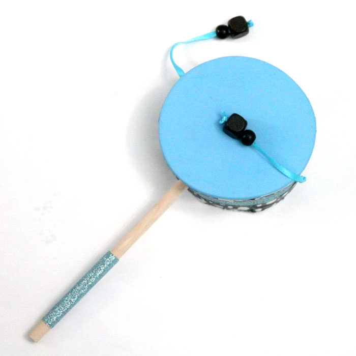 Make this fun diy musical instrument - a hand drum! Such a fun DIY toy for kids, and a craft that kids can help make, decorate, and play with afterward.