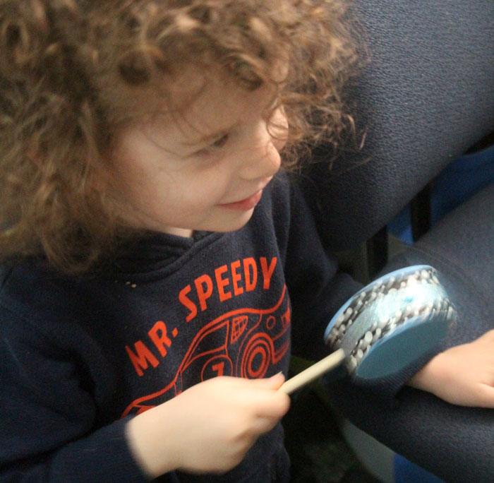 Make this fun diy musical instrument - a hand drum! Such a fun DIY toy for kids, and a craft that kids can help make, decorate, and play with afterward.