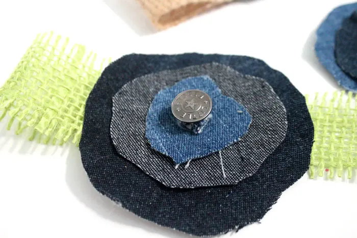 Make these super easy, shabby chic, burlap and recycled denim flowers. Perfect for making DIY accessories like headbands or hair clips, but I used it to update an old onesie. It's also a great way to upcycle and repurpose old jeans and a perfect craft for teens!