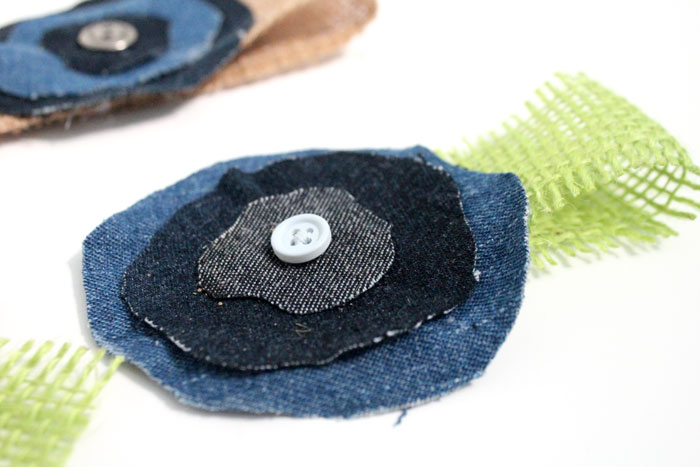 Make these super easy, shabby chic, burlap and recycled denim flowers. Perfect for making DIY accessories like headbands or hair clips, but I used it to update an old onesie. It's also a great way to upcycle and repurpose old jeans and a perfect craft for teens!