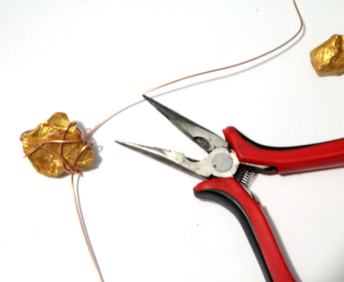 This DIY gold nugget jewelry is so easy to make and one of the cheapest jewelry making tutorials I've seen! Such an easy rock craft and teaches basic wire wrapping to make the pendants. The earrings take literally five minutes.