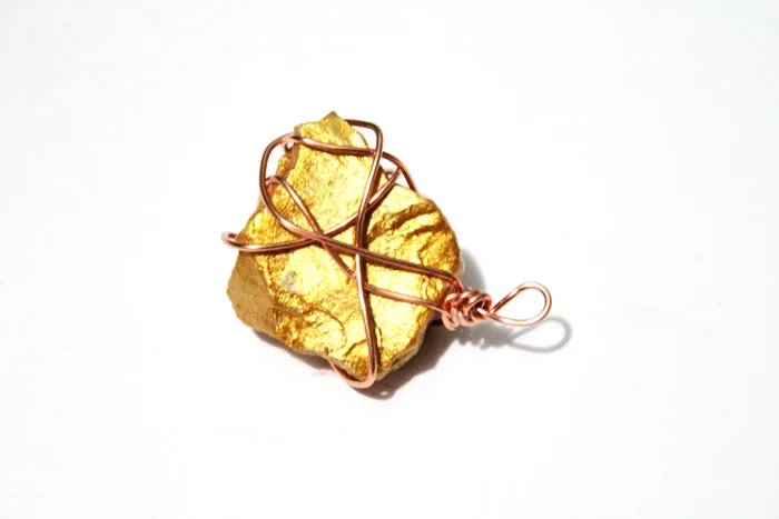 This DIY gold nugget jewelry is so easy to make and one of the cheapest jewelry making tutorials I've seen! Such an easy rock craft and teaches basic wire wrapping to make the pendants. The earrings take literally five minutes.