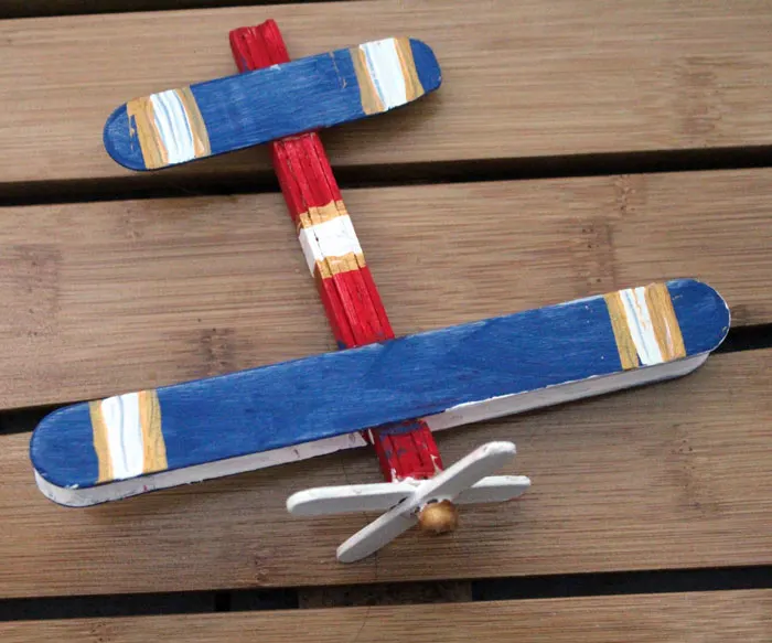 Make this super fun airplane craft - it works as a DIY wooden toy airplane too! I made it for my toddler but big kids can make it too :) It's an adorable flight and travel themed craft for kids 