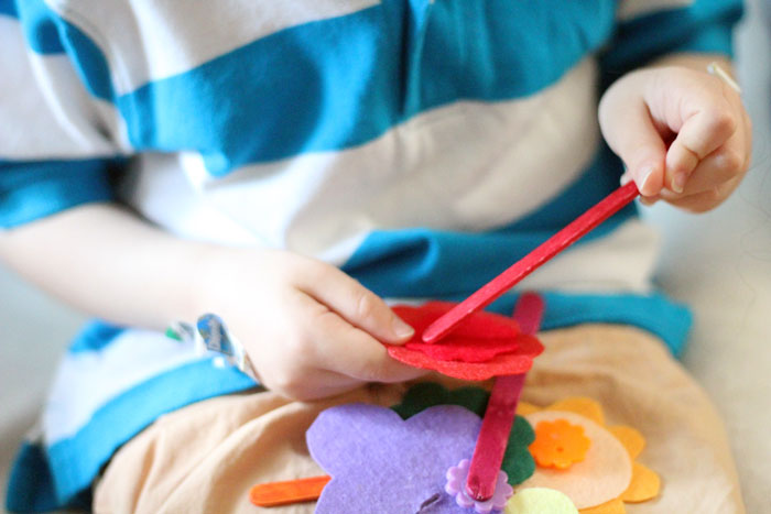 The easiest DIY fine motor toy to make for toddlers and preschoolers! I love these color-matching flowers - a great activity for my toddler to learn and practice colors and fine motor skills at the same time.