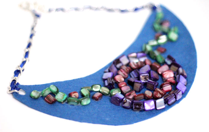 Make a beautiful DIY bib necklace with a pretty mosaic pattern. You can freeform or use symmetrical patterns on this fun jewelry making craft that's perfect for Spring, or any time you want to dress up a plain tee. It's so easy!