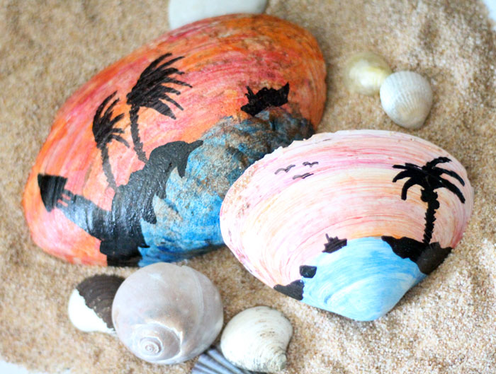 Make a beautiful painted seashell craft that totally fits! The stunning sunset beach scene is so appropriate for shells and makes a great art class prompt too - perfect for some summer fun!