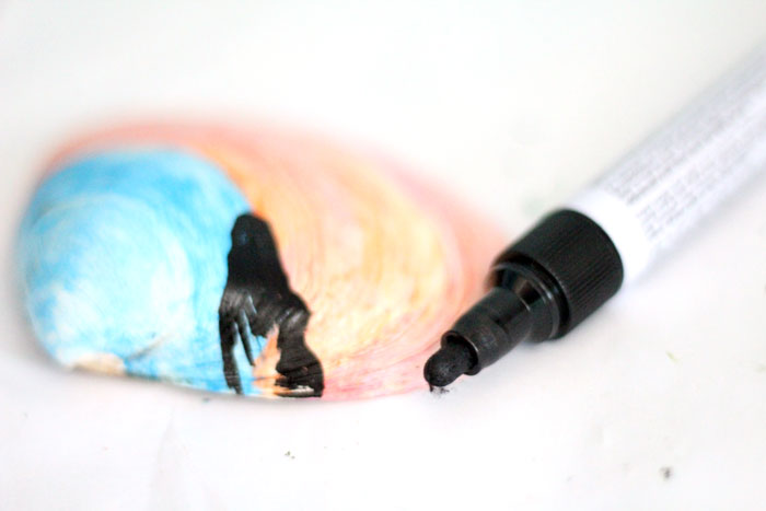 Make a beautiful painted seashell craft that totally fits! The stunning sunset beach scene is so appropriate for shells and makes a great art class prompt too - perfect for some summer fun!