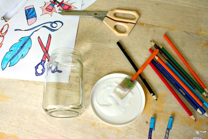 Um, why did I NOT think of this sooner? Check out how my friend took free printable adult coloring page and turned them into cool desk jar organizers, using recycled jars, and costing her literally pennies! This is one of my favorite easy and frugal desk organization ideas!