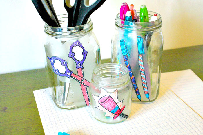 Um, why did I NOT think of this sooner? Check out how my friend took free printable adult coloring page and turned them into cool desk jar organizers, using recycled jars, and costing her literally pennies! This is one of my favorite easy and frugal desk organization ideas!