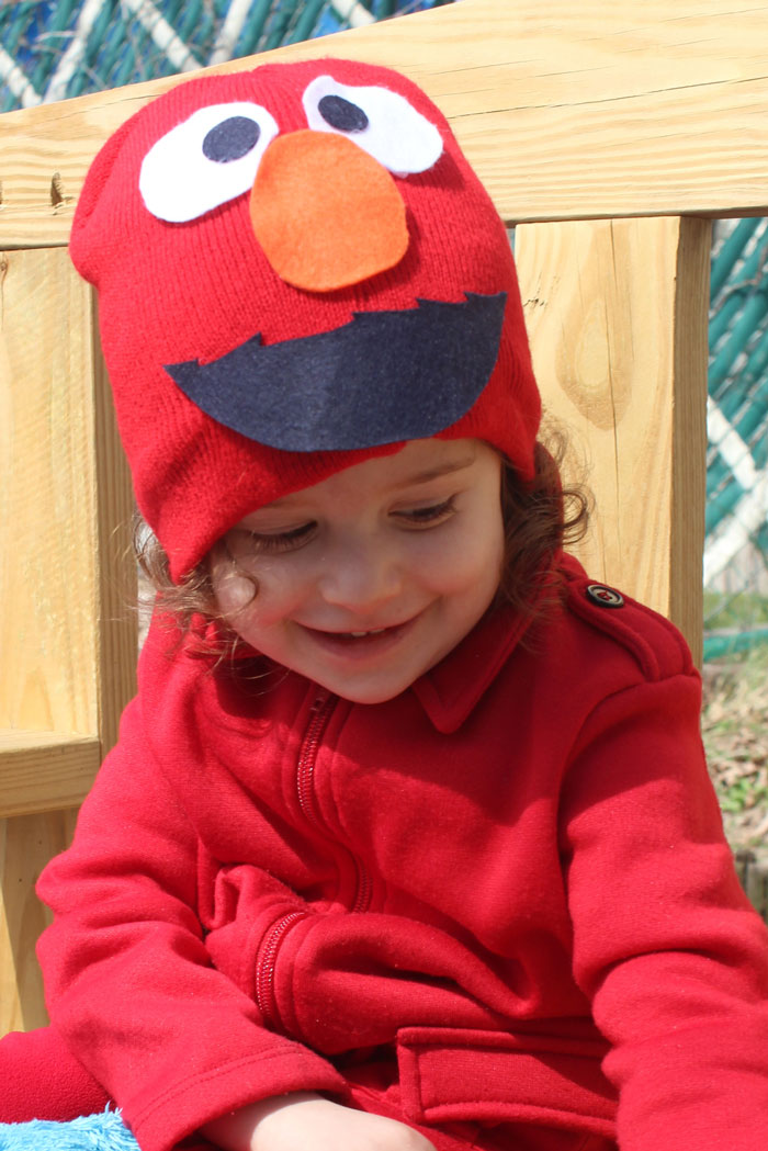 I made this easy DIY Elmo costume for my toddler in minutes! It's a simple, frugal, easy costume idea for toddlers or preschoolers who love Sesame Street and is a no-sew solution for moms who need to do things quickly. Perfect for Halloween or Purim.