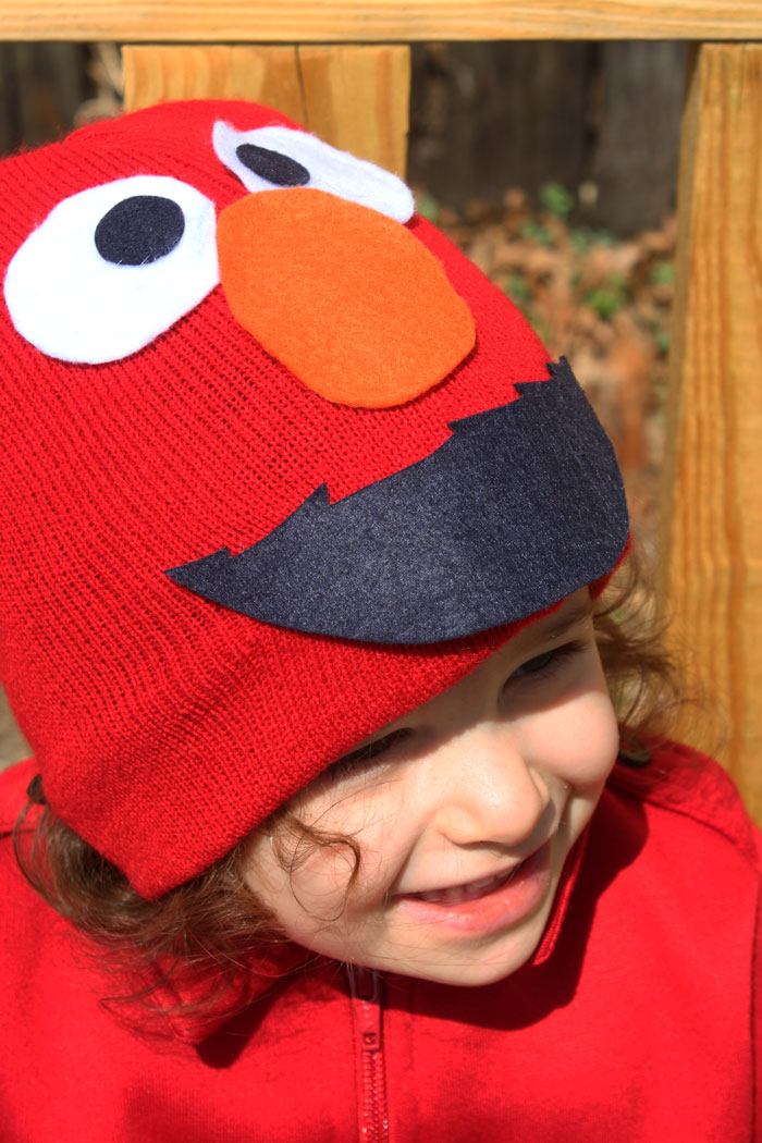 I made this easy DIY Elmo costume for my toddler in minutes! It's a simple, frugal, easy costume idea for toddlers or preschoolers who love Sesame Street and is a no-sew solution for moms who need to do things quickly. Perfect for Halloween or Purim.