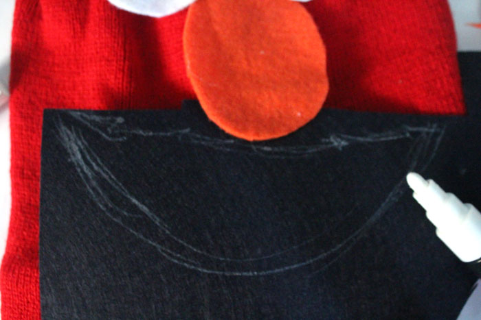 I made this easy DIY Elmo costume for my toddler in minutes! It's a simple, frugal, easy costume idea for toddlers or preschoolers who love Sesame Street and is a no-sew solution for moms who need to do things quickly. Perfect for Halloween or Purim.