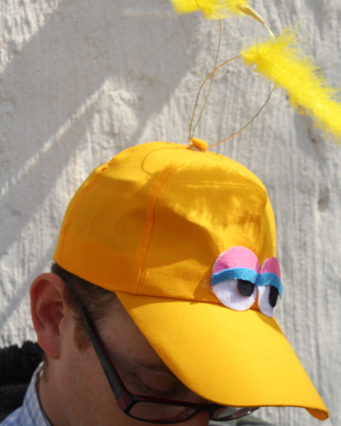 Make an easy no-sew DIY big bird costume hat! You can wear it alone or with a bigger getup, but this definitely speaks sesame street! Perfect for toddlers or adults for halloween, purim, or pretend play.