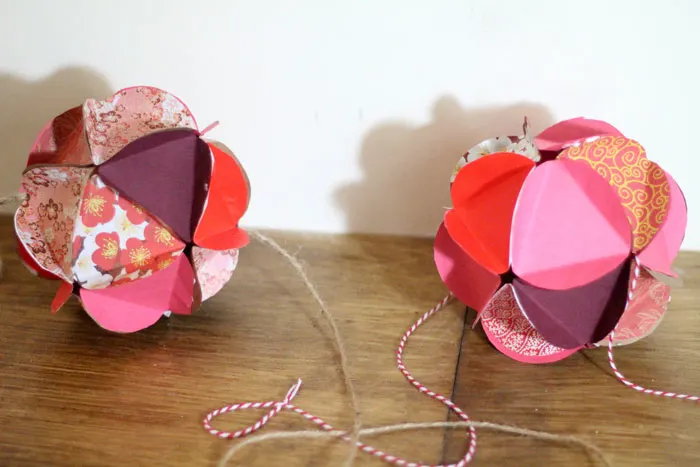 Make a beautiful apple paper globe to decroate your party or home! It's also a great sukkah decoration or rosh hashanah craft - for the Jewish High Holidays. This makes a perfect paper craft for teens and it's easy to adapt into anything.