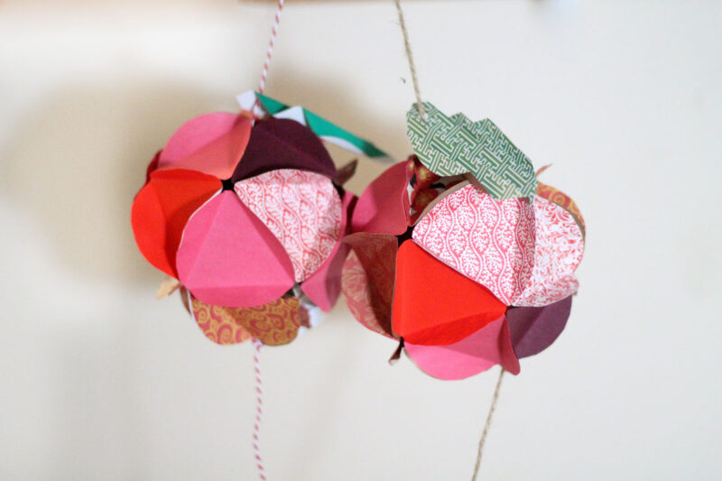 Make a beautiful apple paper globe to decroate your party or home! It's also a great sukkah decoration or rosh hashanah craft - for the Jewish High Holidays. This makes a perfect paper craft for teens and it's easy to adapt into anything.