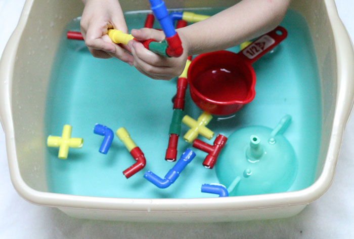 Check out this cool pipes and water play for toddlers activity - a fun sensory soup activity for toddler but also perfect for preschool and young kids! It incorpirates some engineering, problems solving, fine motor skills, plus some plain old silly fun!