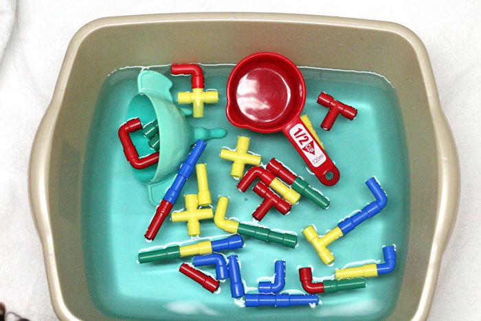 Check out this cool pipes and water play for toddlers activity - a fun sensory soup activity for toddler but also perfect for preschool and young kids! It incorpirates some engineering, problems solving, fine motor skills, plus some plain old silly fun!