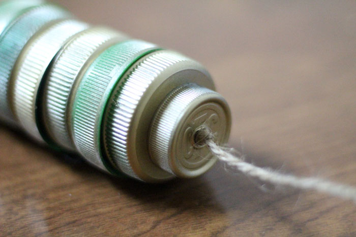 turn your recycling bin into a fun toy! Make a bottle cap rattlesnake craft for your little ones to play with - it actually rattles! This upcycled craft is a fun way to use up your bottle caps and a cute DIY toy idea.